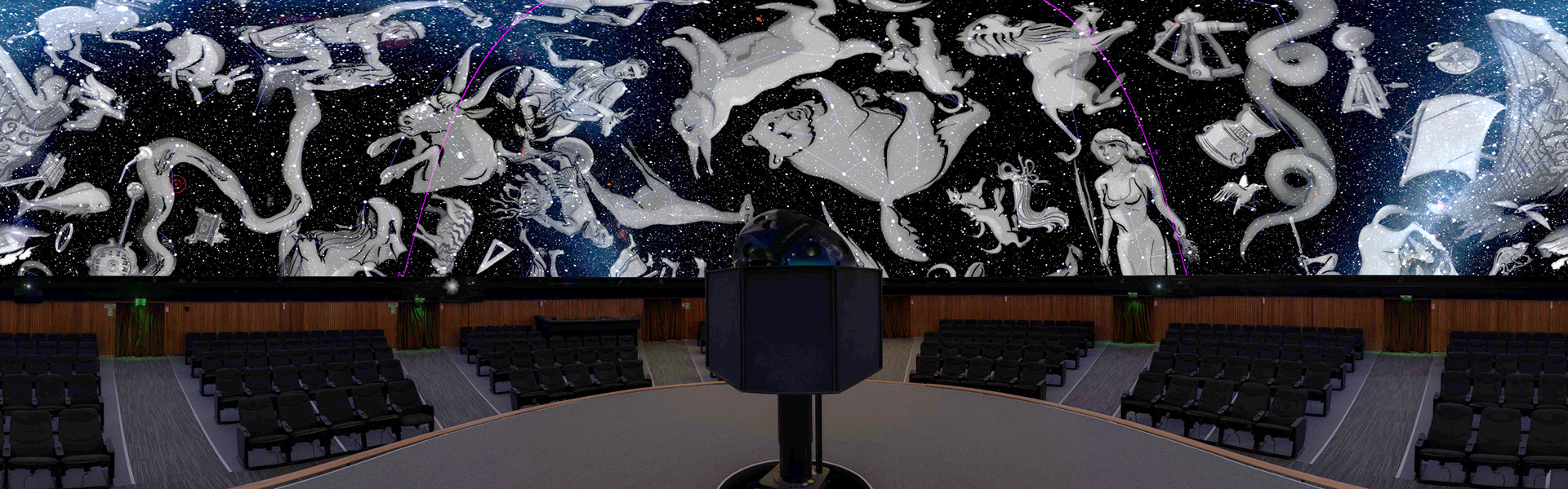 imagen dentro de la sala del Planetario proyectando en la cúpula imagenes de las constelaciones en tonos grises